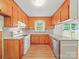Traditional kitchen with white appliances, wood cabinetry, and efficient layout at 197 Horseshoe Loop, Statesville, NC 28625