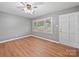 Well-lit living room boasts sleek flooring and neutral wall paint at 197 Horseshoe Loop, Statesville, NC 28625