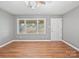 Inviting living room with hardwood floors and bright light from the large windows at 197 Horseshoe Loop, Statesville, NC 28625
