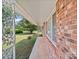 Covered front porch with brick accents and a well-manicured lawn at 197 Horseshoe Loop, Statesville, NC 28625