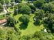Aerial view of property featuring a large grassy area surrounded by mature trees at 2008 Kimway Dr, Matthews, NC 28105