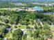 An aerial view of a neighborhood surrounded by large, green wooded area at 2008 Kimway Dr, Matthews, NC 28105