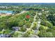 An aerial view showing a large lot that is heavily wooded, great for privacy at 2008 Kimway Dr, Matthews, NC 28105