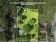 Aerial view of property showing boundaries, mature trees, and surrounding greenery at 2008 Kimway Dr, Matthews, NC 28105
