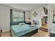 Cozy bedroom with a large window, and view into the kitchen at 2008 Kimway Dr, Matthews, NC 28105