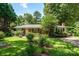 Charming brick ranch home with lush landscaping and inviting front entrance at 2008 Kimway Dr, Matthews, NC 28105
