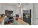 Bright, spacious kitchen with stainless steel appliances, island prep space, and access to living areas at 2008 Kimway Dr, Matthews, NC 28105