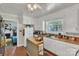 Traditional kitchen with white cabinets, island prep space, and window over the sink at 2008 Kimway Dr, Matthews, NC 28105