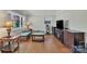 Living room with hardwood floors and bright windows at 2008 Kimway Dr, Matthews, NC 28105