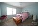 Cozy bedroom with lots of natural light features a comfy bed and wood chest at 2087 Poinsett Dr, Rock Hill, SC 29732