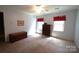 Spacious bedroom with neutral carpet, bright windows, and classic dark-stained furniture at 2087 Poinsett Dr, Rock Hill, SC 29732