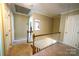 Well-lit hallway featuring white railing, neutral color walls, and carpet flooring at 2087 Poinsett Dr, Rock Hill, SC 29732