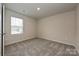 Neutral bedroom featuring carpeted floors, a bright window, and plenty of space at 2136 Sunflower Cir, Newton, NC 28658