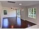 Spacious living room featuring beautiful hardwood floors and large windows providing ample natural light at 218 Hartman St, Gastonia, NC 28052