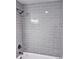 Modern shower with gray tile and contemporary fixtures at 218 Hartman St, Gastonia, NC 28052