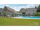 Enjoy the expansive backyard featuring an outdoor patio with ample seating next to a pristine pool at 2256 Drawbridge Ct, Rock Hill, SC 29732