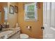 A well-lit bathroom features a granite vanity, toilet, and window at 2256 Drawbridge Ct, Rock Hill, SC 29732