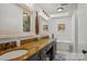 A modern bathroom features double sinks, a soaking tub, and white shiplap walls at 2256 Drawbridge Ct, Rock Hill, SC 29732