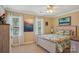 A bright bedroom features a tropical theme, natural light, and carpet at 2256 Drawbridge Ct, Rock Hill, SC 29732