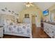 Cozy bedroom with vaulted ceilings, hardwood floors, and coastal-themed decor at 2256 Drawbridge Ct, Rock Hill, SC 29732