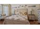 Inviting bedroom featuring coastal decor, matching nightstands, and hardwood floors at 2256 Drawbridge Ct, Rock Hill, SC 29732