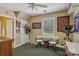 Neutral bonus room featuring olive green carpet, exercise bike, and art at 2256 Drawbridge Ct, Rock Hill, SC 29732
