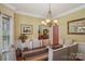 A traditional dining room features a wood table and upholstered chairs, with elegant decor at 2256 Drawbridge Ct, Rock Hill, SC 29732