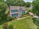 Beautifully landscaped front yard with flowering shrubs and mature trees surrounding this two-story home at 2256 Drawbridge Ct, Rock Hill, SC 29732
