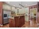 Cozy kitchen featuring custom cabinets, stainless steel appliances, and hardwood floors, with an open and functional design at 2256 Drawbridge Ct, Rock Hill, SC 29732