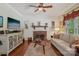 Bright living room features a brick fireplace, shiplap accent wall, and cozy seating area with rustic wooden floors at 2256 Drawbridge Ct, Rock Hill, SC 29732