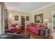 Cozy living room with warm tones features hardwood floors and elegant decor with comfortable seating furniture at 2256 Drawbridge Ct, Rock Hill, SC 29732
