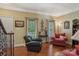 Comfortable seating area with hardwood floors, natural light, and tasteful decor to create a relaxing atmosphere at 2256 Drawbridge Ct, Rock Hill, SC 29732