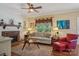 Bright living room features a brick fireplace, shiplap accent wall, and cozy seating area with rustic wooden floors at 2256 Drawbridge Ct, Rock Hill, SC 29732