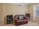 Cozy room with a brown sofa, built-in shelves, and plenty of natural light from the window at 2256 Drawbridge Ct, Rock Hill, SC 29732