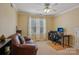Comfortable office space featuring a brown leather sofa and a functional computer setup at 2256 Drawbridge Ct, Rock Hill, SC 29732