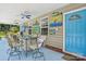 Covered patio featuring blue concrete, outdoor seating and tropical decorations at 2256 Drawbridge Ct, Rock Hill, SC 29732