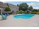 Enjoy a refreshing dip in this backyard pool, surrounded by patio space and comfortable seating at 2256 Drawbridge Ct, Rock Hill, SC 29732