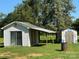 Two storage sheds in backyard with tin roof and siding at 22987 Alonzo Rd, Oakboro, NC 28129