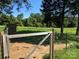 Backyard gate with trees and a storage shed in the background at 22987 Alonzo Rd, Oakboro, NC 28129