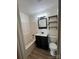 Bathroom with vanity, tub and shower combo, and open shelving at 22987 Alonzo Rd, Oakboro, NC 28129
