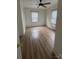 An open bedroom featuring wood-look flooring and a ceiling fan at 22987 Alonzo Rd, Oakboro, NC 28129