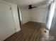 Bedroom with wood-look floors and ceiling fan at 22987 Alonzo Rd, Oakboro, NC 28129
