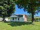 Charming home with mature trees offering shade and curb appeal to the front yard at 22987 Alonzo Rd, Oakboro, NC 28129
