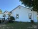 Home exterior with covered porch, siding, and lawn at 22987 Alonzo Rd, Oakboro, NC 28129
