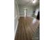 Spacious living room with fireplace and wood-look flooring at 22987 Alonzo Rd, Oakboro, NC 28129