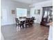 Bright dining room with wood floors, a large window, and a classic wood china cabinet at 231 Glenwood Dr # 4, Oakboro, NC 28129