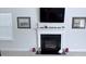 Elegant fireplace with a decorative mantel and a TV above, creating a cozy focal point in the living space at 231 Glenwood Dr # 4, Oakboro, NC 28129