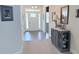 Bright foyer with a view of the front door, adorned with tasteful decorations and neutral paint at 231 Glenwood Dr # 4, Oakboro, NC 28129