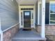 Welcoming front door with sidelights and a stylish stone facade complements this beautiful home at 231 Glenwood Dr # 4, Oakboro, NC 28129