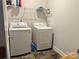 Laundry room featuring new washer and dryer appliances and shelving for storage at 231 Glenwood Dr # 4, Oakboro, NC 28129